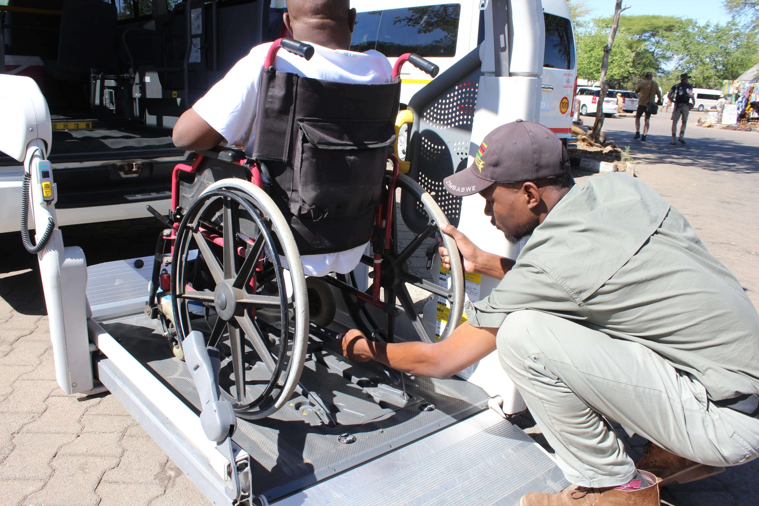 Escape to Adventure – Carefully attaching the wheelchair to the disabled lift