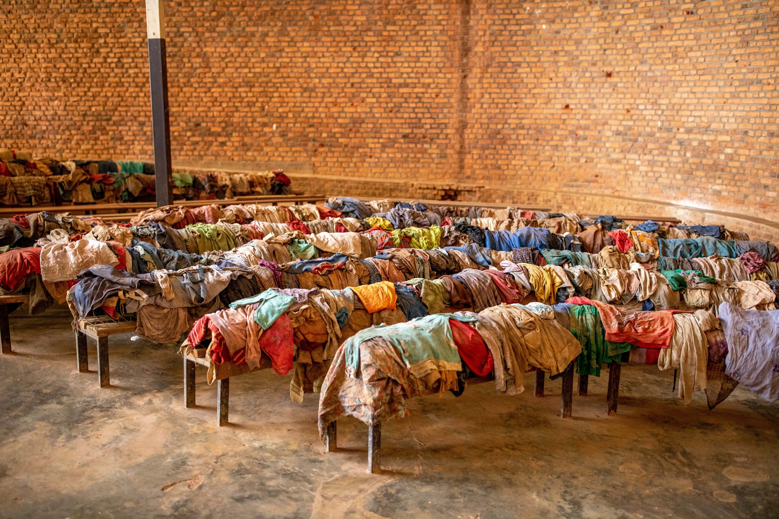 Nyamata Genocide Memorial Center, Nyamata, Rwanda. Victims’ clothes on church pews